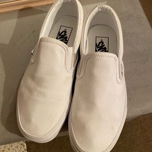 All white slip on vans